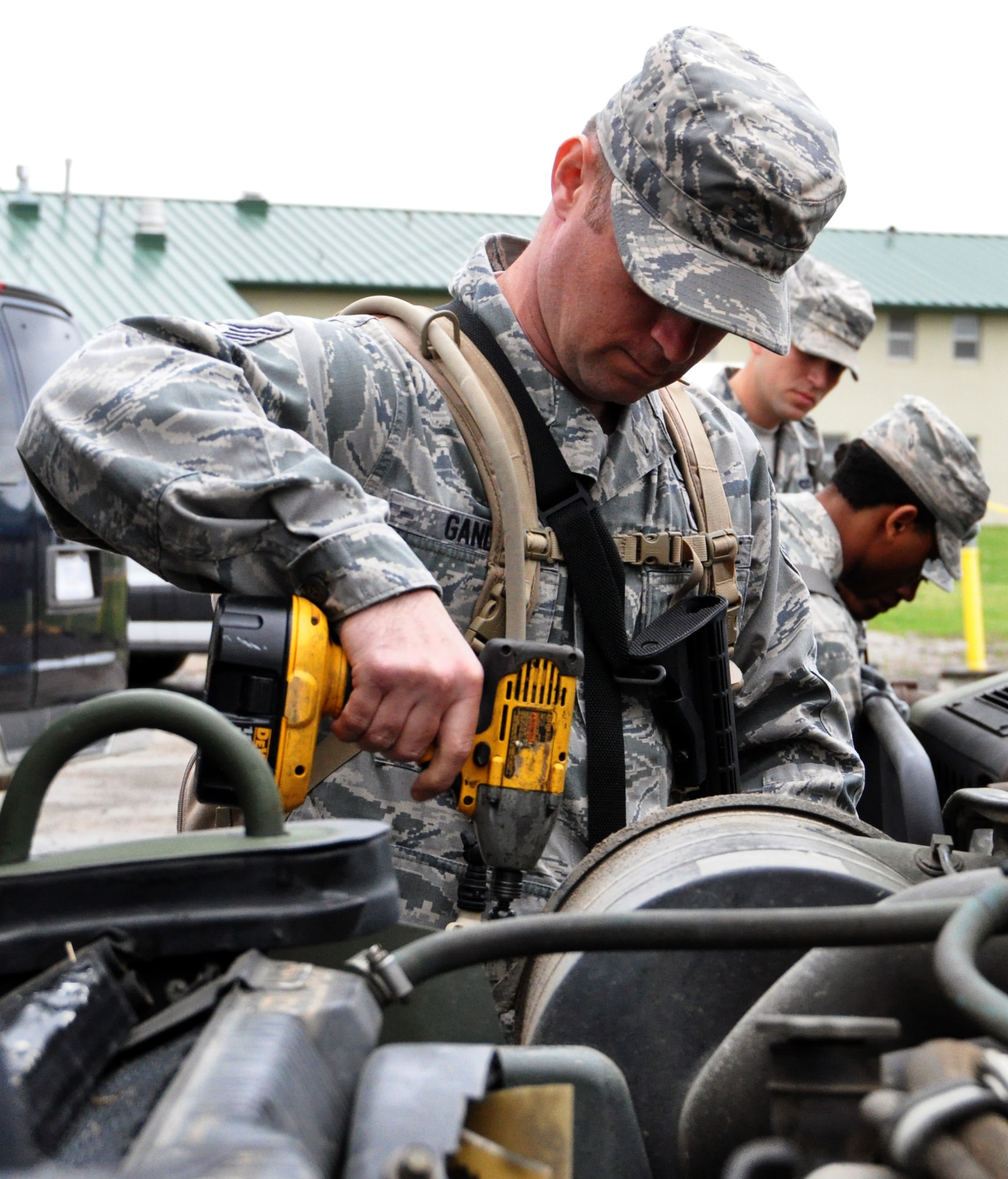 Tech. Sgt. Jason Gandee, 931st Civil Engineer Squadron, preps a High Mobility Multipurpose Wheeled Vehicle (HMMWV) for a convoy operations training exercise at Camp Gruber Training Center, Okla., April 15, 2015.  More than 80 members of the 931 CES and 931st Security Forces Squadron participated in ten days of combat skills training at Camp Gruber, which included land navigation, weapons training, tactical movements, convoy operations, base defense, room clearing procedures, foot patrols, military operations on urban terrain (MOUT) and combat lifesaving.  (U.S. Air Force photo by Capt. Zach Anderson)
