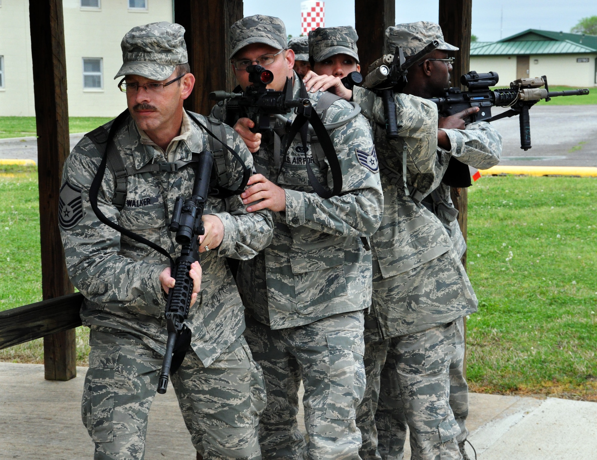 Members of the 931st Security Forces Squadron and 931st Civil Engineer Squadron practice room clearing procedures at Camp Gruber Training Center, Okla., April 15, 2015. More than 80 members of the two squadrons participated in ten days of combat skills training at Camp Gruber, which included land navigation, weapons training, tactical movements, convoy operations, base defense, room clearing procedures, foot patrols, military operations on urban terrain (MOUT) and combat lifesaving.  (U.S. Air Force photo by Capt. Zach Anderson)
