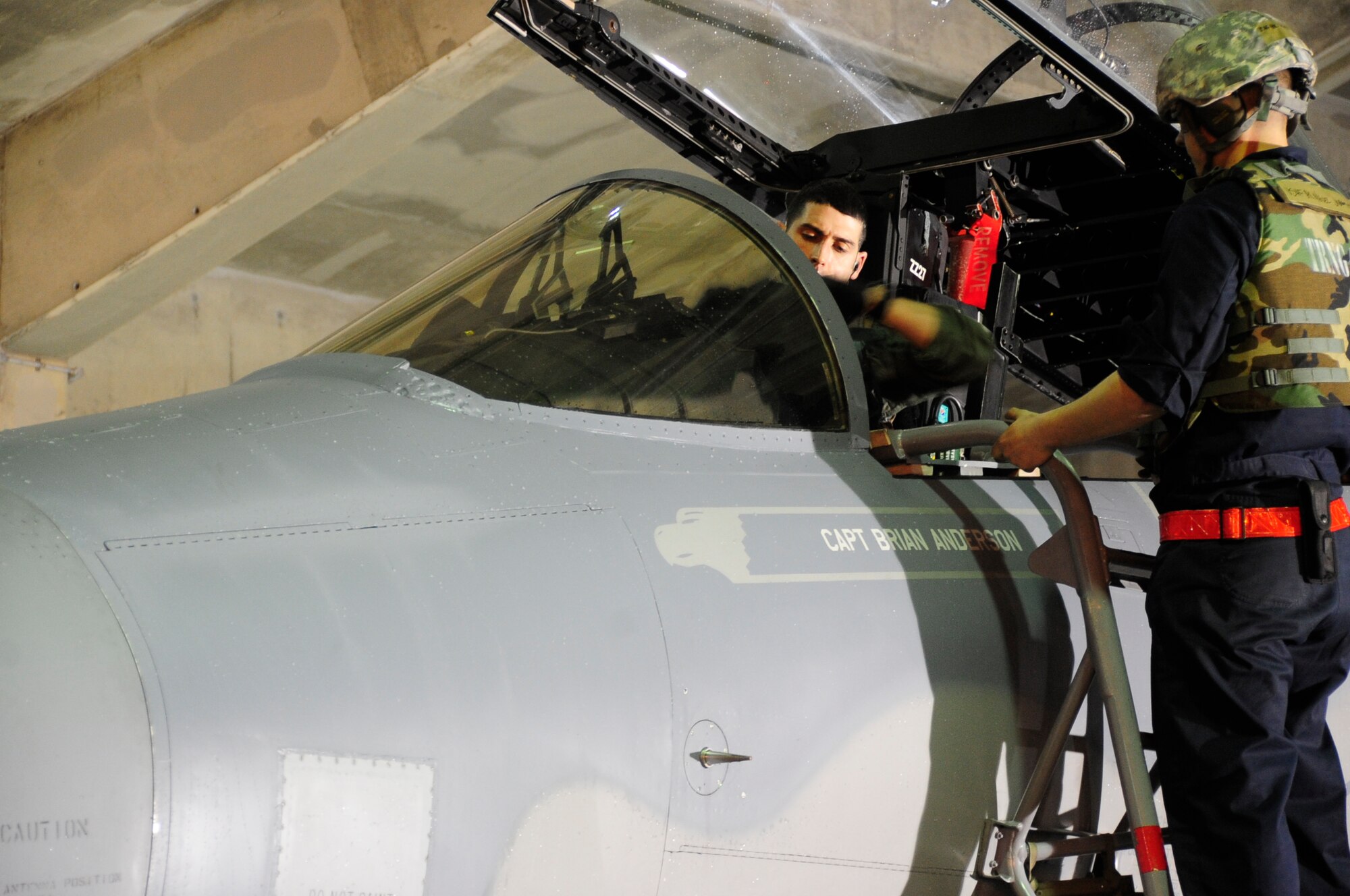 U.S. Air Force Capt. Brian Anderson, an F-15 Eagle fighter pilot with 67th Fighter Squadron, prepares to exit his jet after performing a post flight control check during Exercise Beverly High 15-2 at Kadena Air Base, Japan, April 20, 2015. The exercise tested the 18th Wings ability to deploy and react during contingency operations. (U.S. Air Force photo/Senior Airman Omari Bernard)