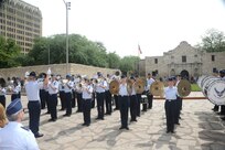 The Joint Base San Antonio-Lackland Drum and Bugle Corps, comprised of Air Force basic military trainees who have been in the Air Force less than seven weeks, perform during Air Force at the Alamo during Fiesta San Antonio April 20. From its beginning in 1891, Fiesta has grown into an annual celebration that includes civic and military observances, street and river float parades, exhibits, sports, music and food representing the spirit, diversity and vitality of San Antonio. (U.S. Air Force photo by Melissa Peterson/released)