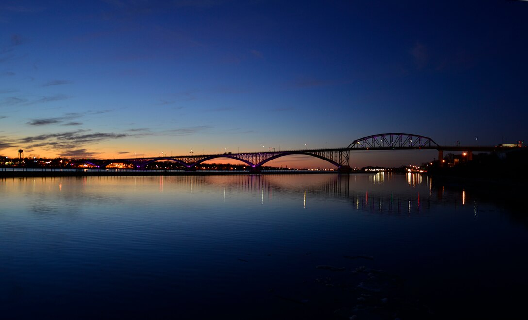 The Peace Bridge, an international bridge between Canada and the United States, displays purple lights as part of the Purple Up! campaign to show support and recognize the sacrifices and strength of military children, April 15, 2015. (U.S. Air Force photo by Tech. Sgt. Stephanie Sawyer)   