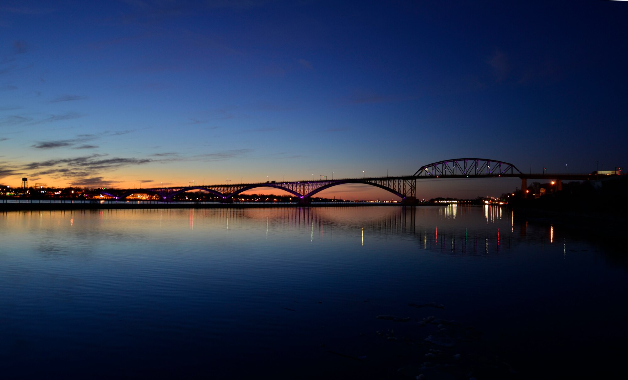 The Peace Bridge, an international bridge between Canada and the United States, displays purple lights as part of the Purple Up! campaign to show support and recognize the sacrifices and strength of military children, April 15, 2015. (U.S. Air Force photo by Tech. Sgt. Stephanie Sawyer)   