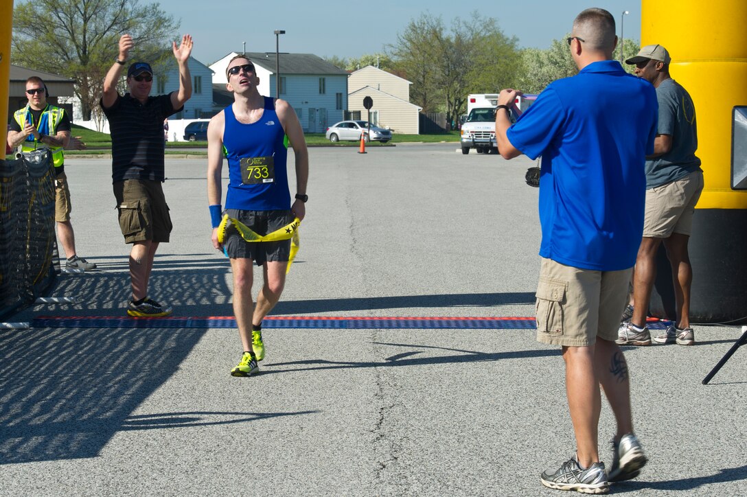 Capt. Philip Blong, 70th Intelligence Surveillance Reconnaissance Wing deputy director of plans and programs, finishes first place at the Joint Base Andrews Half-Marathon, April 18, 2015 at Joint Base Andrews, Maryland. He finished with a time of 1:22:41.  (U.S. Air Force photo/Senior Airman Mariah Haddenham)