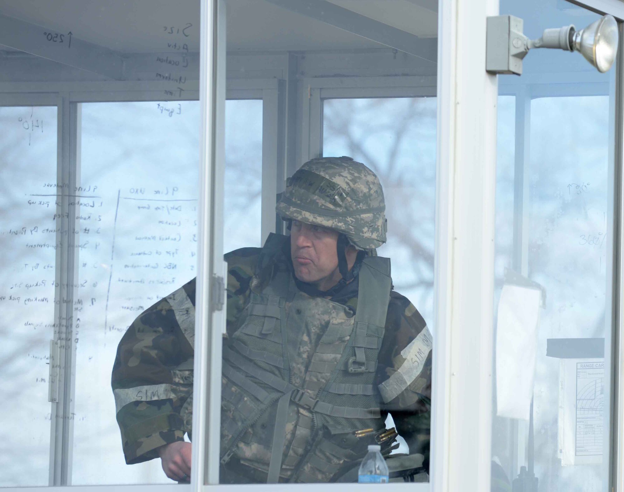 Staff Sgt. Matthew Auger, 28th Civil Engineer Squadron heating, ventilation and air conditioning technician, mans an entry control point during an operational readiness exercise at Camp Lancer on Ellsworth Air Force Base, S.D., March 30, 2015. OREs are designed to prepare and train Airmen for real-world contingencies in a deployed environment. (U.S. Air Force photo by Airman 1st Class Rebecca Imwalle/ Released)