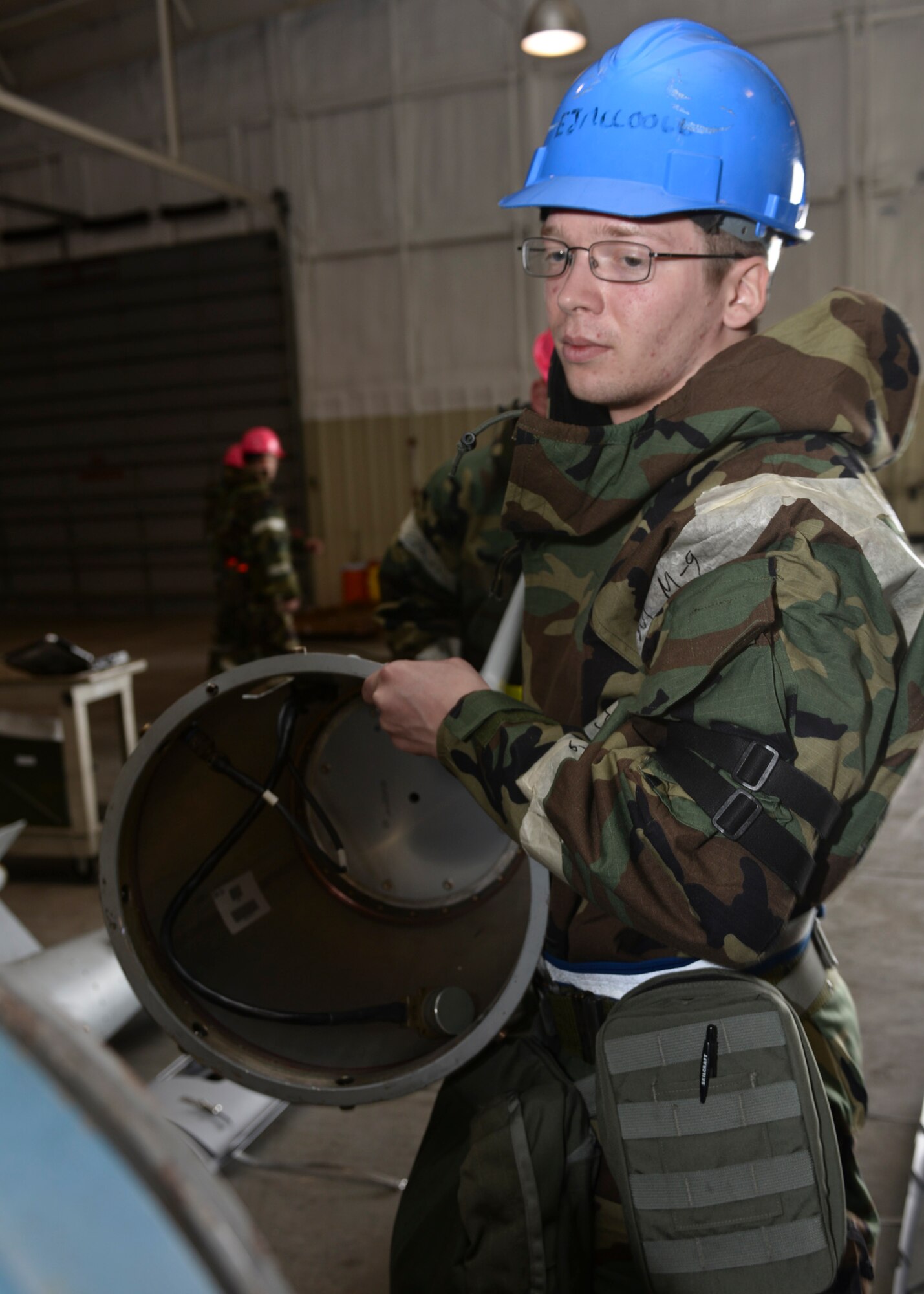 Airman 1st Class Jesse Knappen, 28th Munitions Squadron conventional maintenance technician, assembles a GBU-31 during an operation readiness exercise at Ellsworth Air Force Base, S.D., March 30, 2015.  The 28th MUNS goal during the ORE was to evaluate the effectiveness, maintainability, suitability and accuracy of precision guided munitions and other advanced air to ground weapons. (U.S. Air Force photo by Senior Airman Anania Tekurio/Released)
