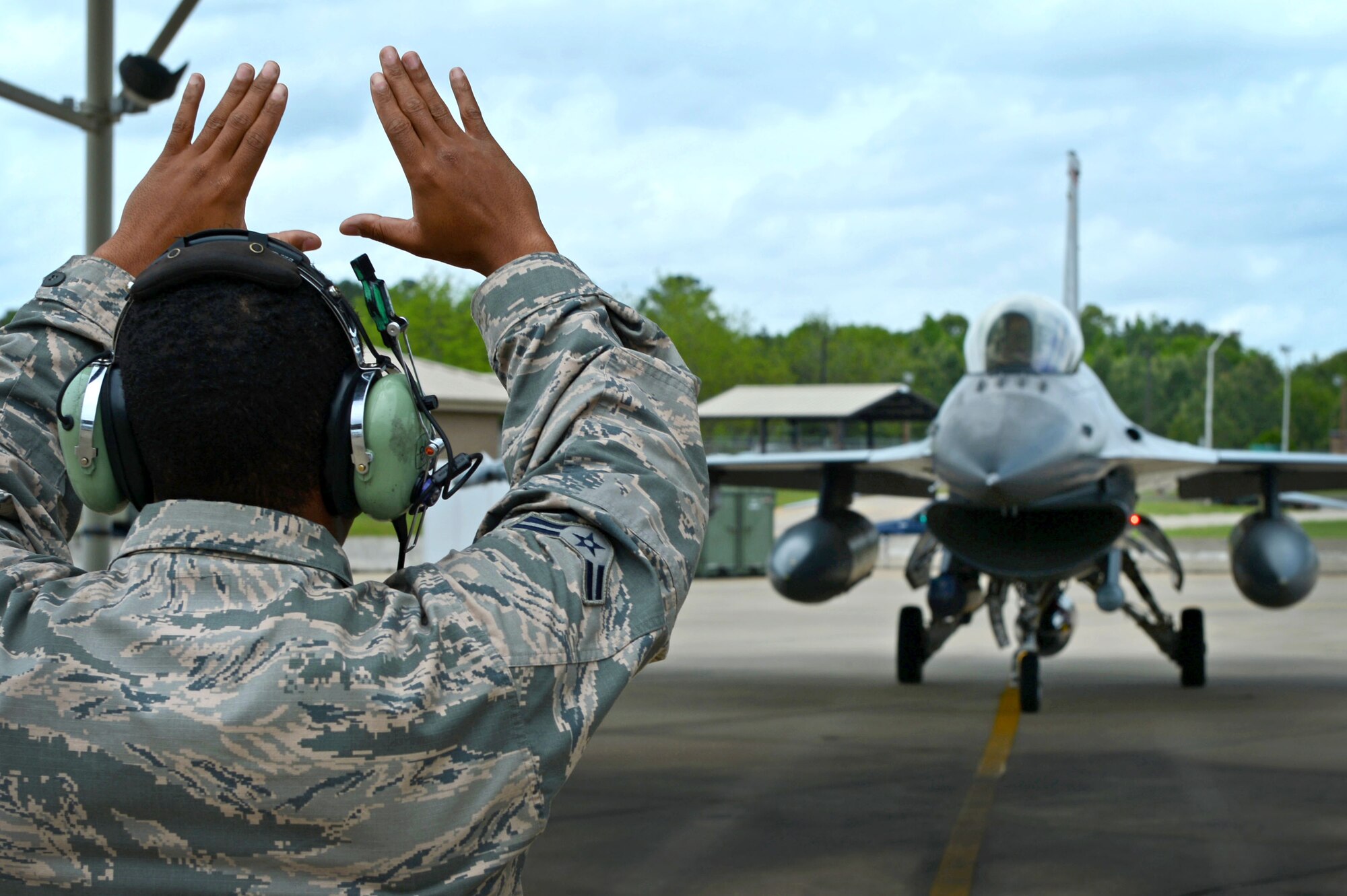 A U.S. Air Force Airman assigned to the 20th Fighter Wing returns from a deployment at Shaw Air Force Base, S.C., April 20, 2015. Approximately 200 Airmen deployed to the United States Central Command AOR for six month. (U.S. Air Force photo by Senior Airman Jensen Stidham/Released)