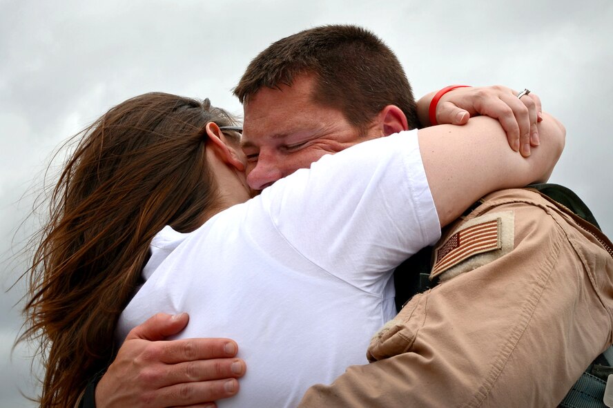 A U.S. Air Force Airman assigned to the 20th Fighter Wing returns from a deployment at Shaw Air Force Base, S.C., April 20, 2015. Approximately 200 Airmen deployed to the United States Central Command AOR for six month. (U.S. Air Force photo by Senior Airman Jensen Stidham/Released)