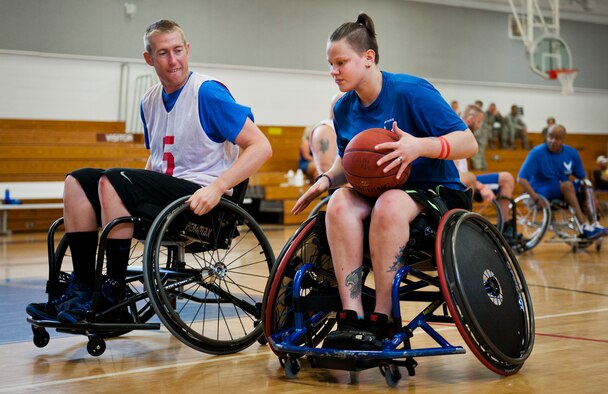 Michael Gentry and Haley Gilbreath, Air Force Wounded Warrior athletes, battle for position around the basket at wheelchair basketball practice during the third day of the Warrior Games training camp at Eglin Air Force Base, Fla., April 20. The five-day training camp for the Air Force’s athletes serves as their last practice session before the Warrior Games June 19-28. (U.S. Air Force photo/Samuel King Jr.)