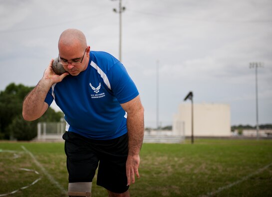 Jason Caswell, an Air Force Wounded Warrior athlete, prepares to launch his throw at a shot put practice during the third day of the Warrior Games training camp at Eglin Air Force Base, Fla., April 20. The five-day training camp for the Air Force’s athletes serves as their last practice session before the Warrior Games June 19-28. (U.S. Air Force photo/Samuel King Jr.)