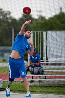 Nick Dadgoster, an Air Force Wounded Warrior athlete, releases the discus at a track and field session during the third day of the Warrior Games training camp at Eglin Air Force Base, Fla., April 20. The five-day training camp for the Air Force’s athletes serves as their last practice session before the Warrior Games June 19-28. (U.S. Air Force photo/Samuel King Jr.)
