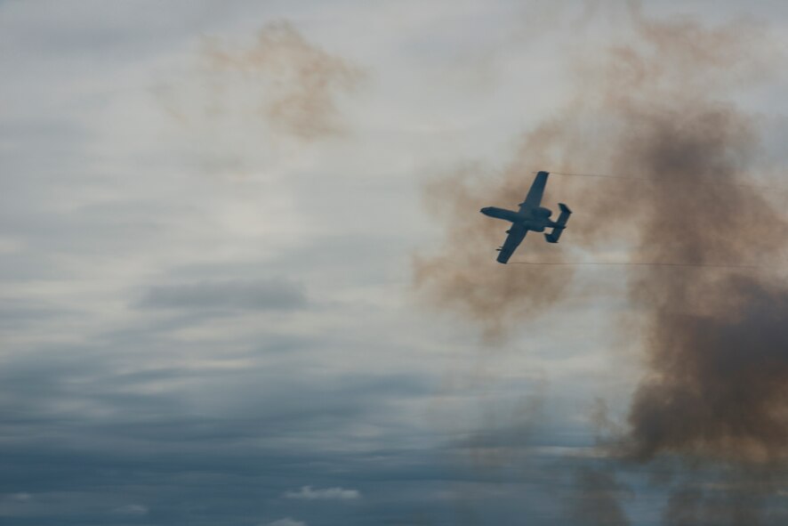 An A-10C Thunderbolt II from the 23d Fighter Group peels off after a strafing run over Grand Bay Bombing and Gunnery Range April 17, 2015, at Moody Air Force Base, Ga. The A-10C participated in a combat search and rescue task force demonstration alongside HH-60G Pave Hawks and an HC-130J Combat King II. (U.S. Air Force photo by Senior Airman Ryan Callaghan/Released)