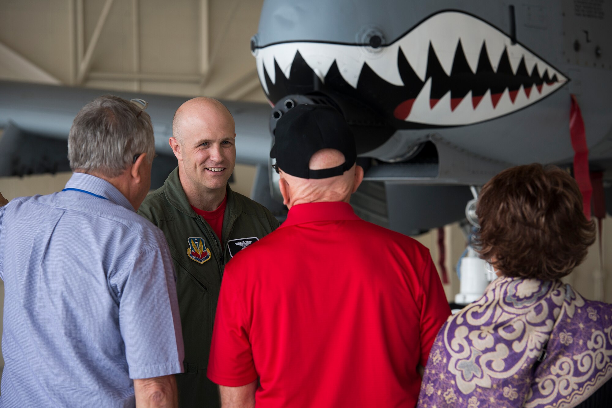 U.S. Air Force Maj. Jeremiah Parvin, 75th Fighter Squadron A-10C Thunderbolt II pilot, briefs guests of the Red Carpet of South Georgia’s 50th Anniversary party during a base tour April 17, 2015, at Moody Air Force Base, Ga. The Red Carpet Committee is a group of local civic leaders committed to supporting Moody and its military families. (U.S. Air Force photo by Senior Airman Ryan Callaghan/Released)