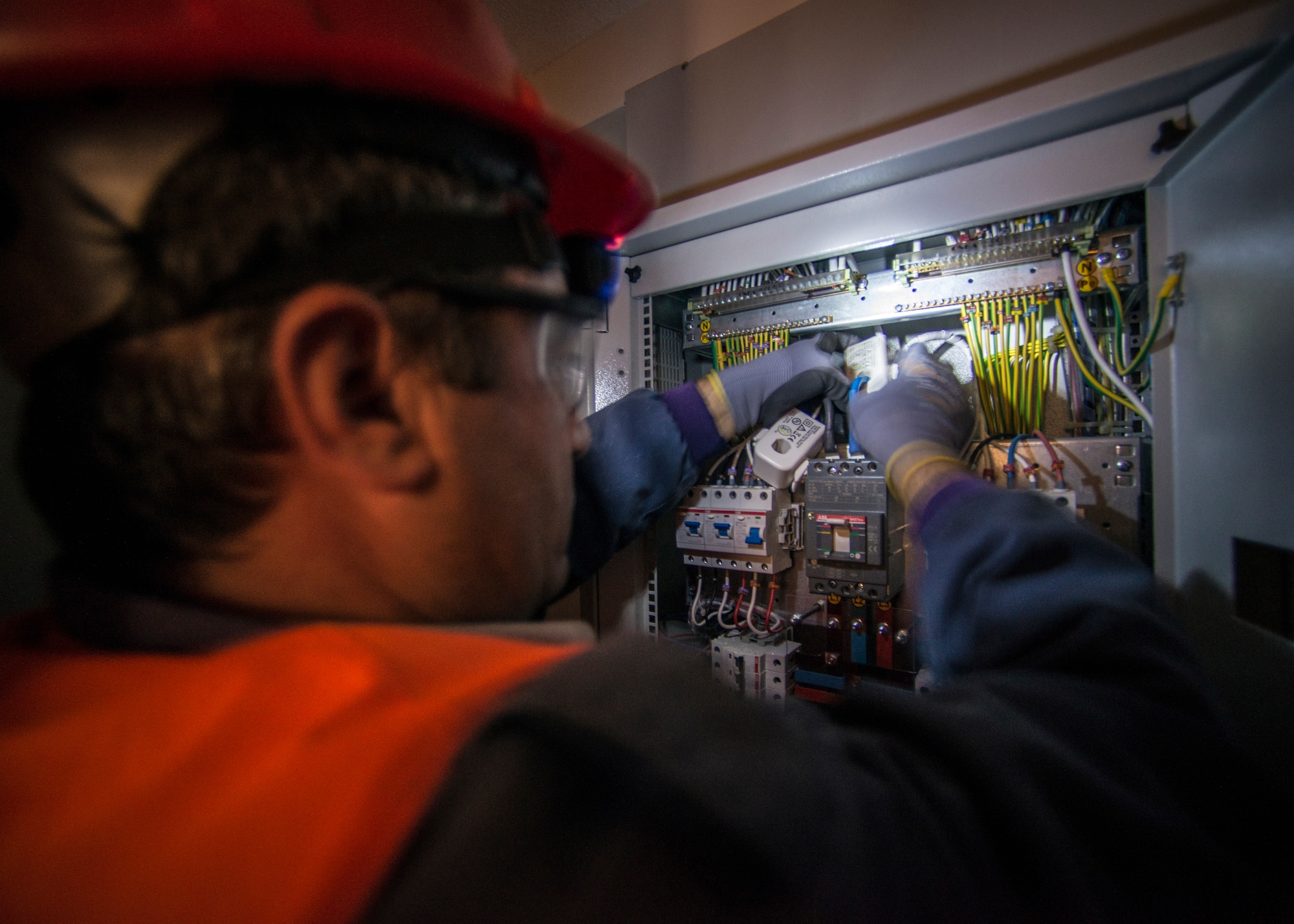 Rasit Dincel, 39th Civil Engineer Squadron electric engineer, installs a new Residential Energy Efficiency Program wireless energy monitoring device into a Phantom Housing unit April 13, 2015, at Incirlik Air Base, Turkey. Each renovated housing unit is receiving the REEP monitor by the end of May 2015. (U.S. Air Force photo by Airman 1st Class Cory W. Bush/Released)