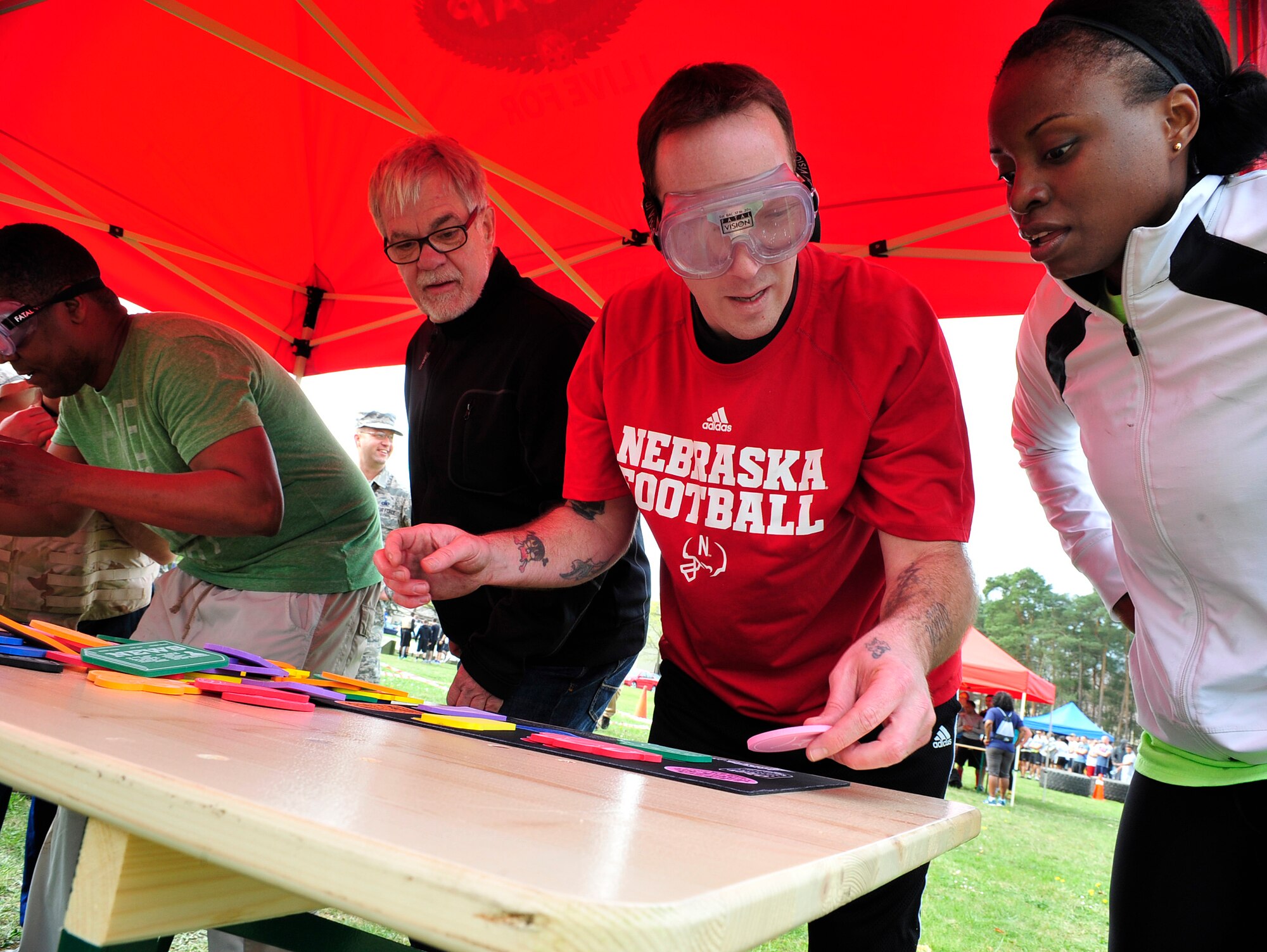 A team works together to complete a puzzle obstacle during the Courage, Leadership, Education, Advocacy and Respect Challenge April 17, 2015 at Ramstein Air Base, Germany. The CLEAR Challenge teams went through an obstacle course with challenges representing struggles a sexual assault victim may endure. (Airman 1st Class Larissa Greatwood)