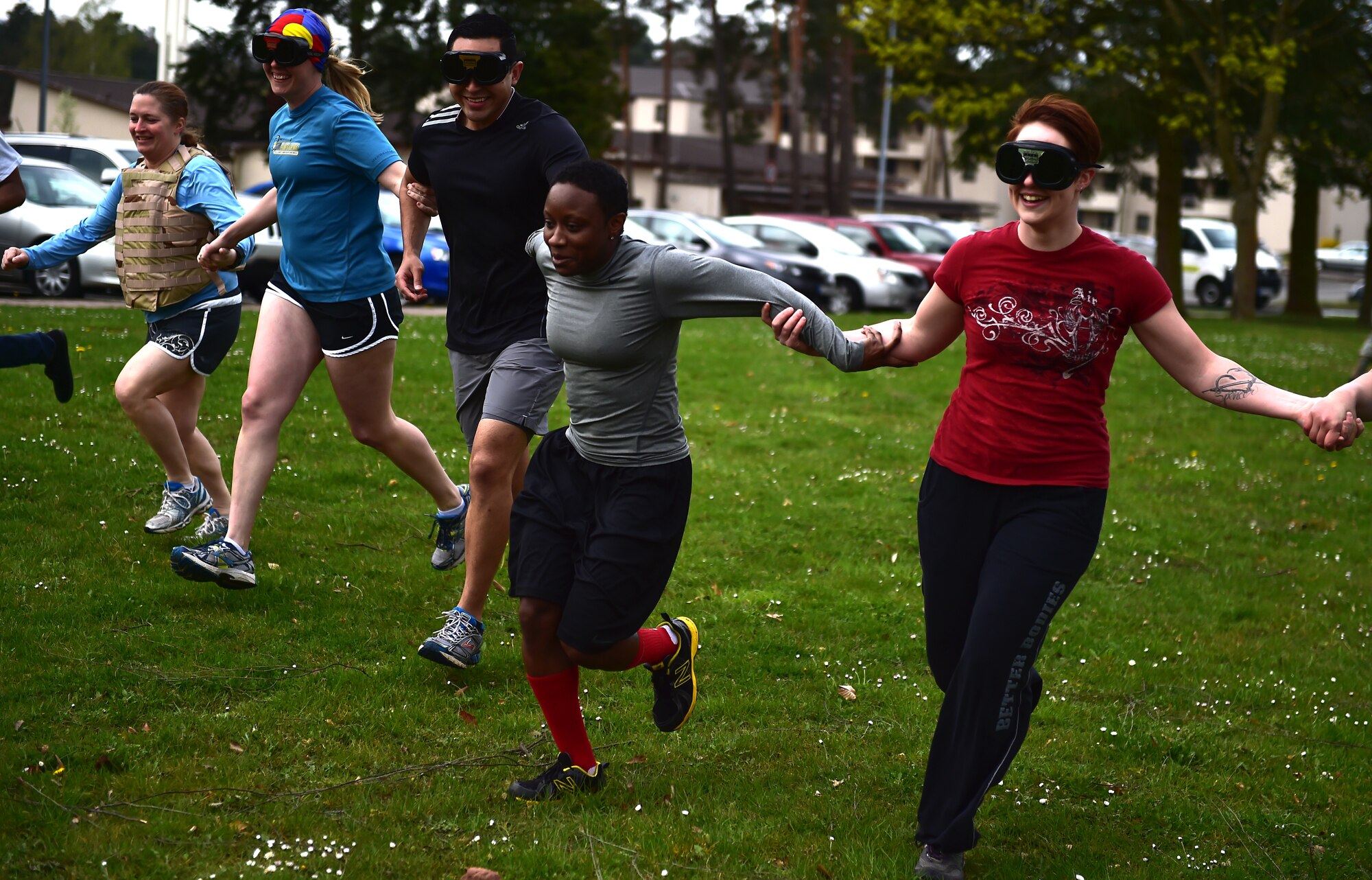 A six-man team from the 86th Medical Operations Squadron participates in the drunk goggle obstacle during the Courage, Leadership, Education, Advocacy and Respect Challenge April 17, 2015, at Ramstein Air Base, Germany. The CLEAR Challenge was a physically and mentally challenging course symbolizing the effects of sexual assault and alcohol abuse. Teams competed to complete the tasks or obstacles for the best time. (U.S. Air Force photo/Staff Sgt. Sara Keller)