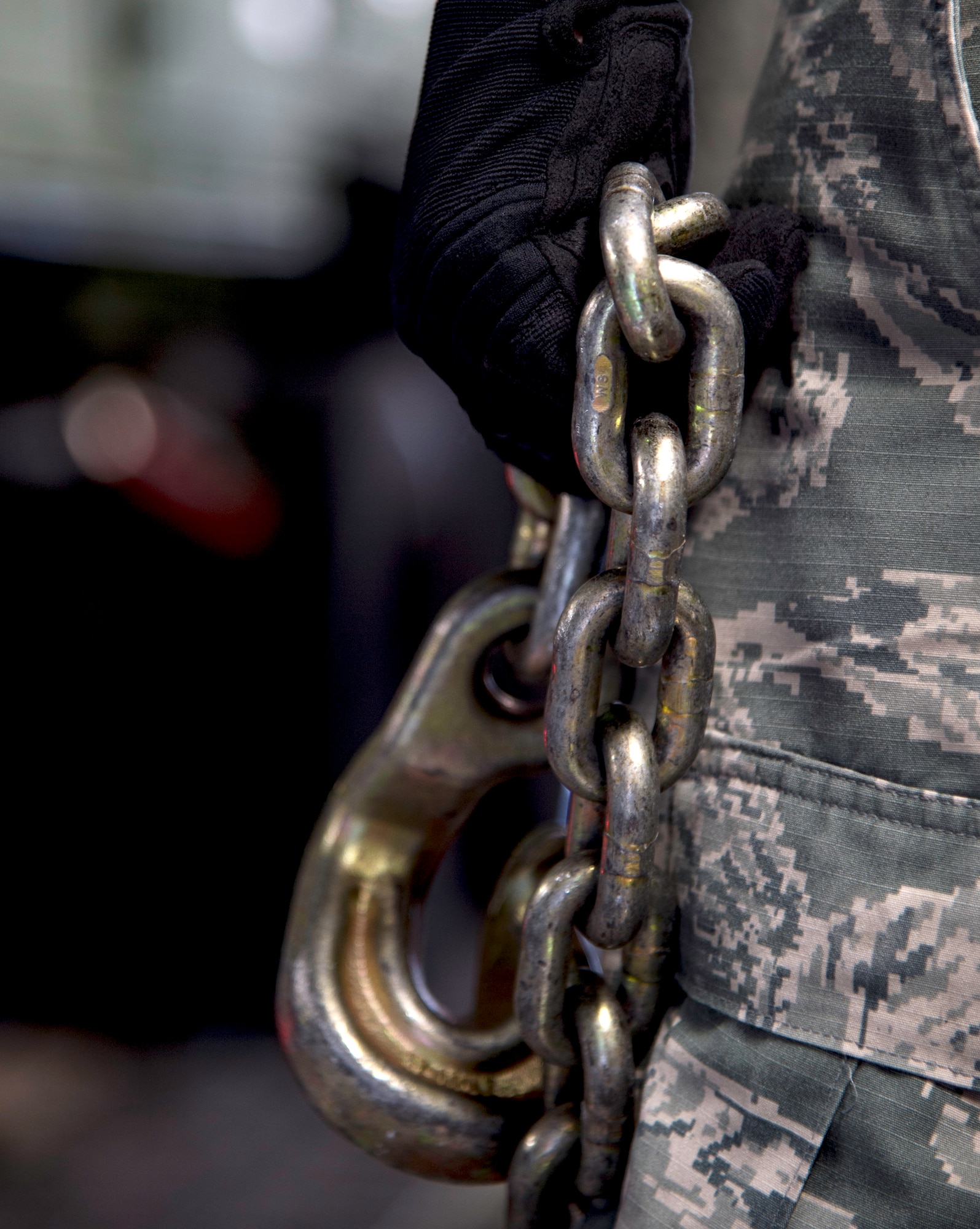 The 89th Aerial Port Squadron aircraft specialists use chains with hooks to secure cargo to the floor of a C-17 Globemaster III at Joint Base Andrews, Md., April 15, 2015. Aircraft specialists make sure cargo is accounted for, safe to fly and loaded on time. (U.S. Air Force photo/Airman 1st Class Philip Bryant)
