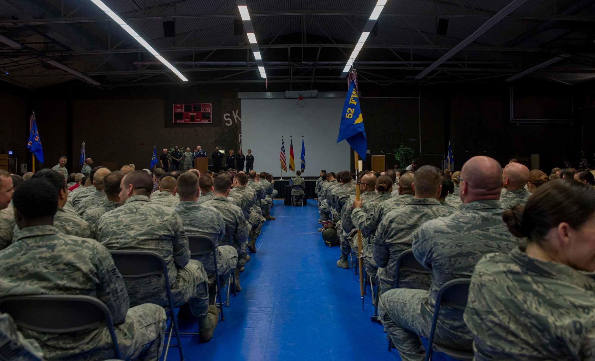 Various squadrons from the 52nd Mission Support Group sit in seats during the 52nd MSG commander’s call at the Skelton Memorial Fitness Center in Spangdahlem Air Base, Germany, April 16, 2015. The gathering also included a medals presentation ceremony for U.S. Air Force Senior Master Sgt. Christopher Collins, 52nd Civil Engineer Squadron facilities systems superintendent. (U.S. Air Force photo by Airman 1st Class Timothy Kim/Released)