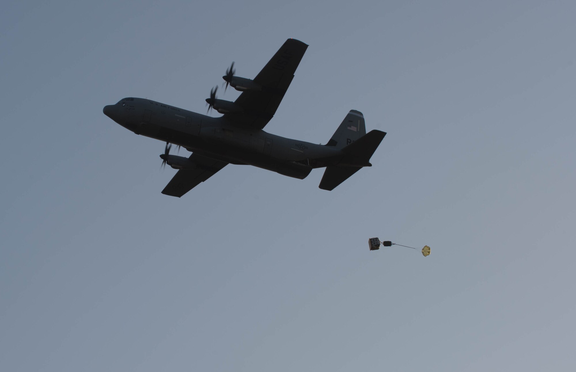 A C-130J Super Hercules assigned to the 37th Airlift Squadron airdrops a container delivery system for the first time over Powidz Air Base, Poland, April 15, 2015. Pilots from the 37th AS flew to Powidz to train alongside their Polish counterparts. During the training, the Airmen practiced formation flying nighttime low level training, unimproved landing zone and dropping Polish air force paratroopers. (U.S. Air Force photo/Senior Airman Jonathan Stefanko)