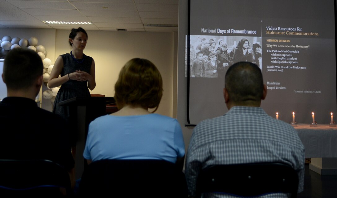 Capt. Lindsey Callahan, 39th Air Base Wing Legal Office assistant staff judge advocate, speaks to those in attendance during a Holocaust Remembrance Ceremony April 17, 2015, at Incirlik Air Base, Turkey. The ceremony was held to honor the more than six million Jews who perished and endured during Holocaust. (U.S. Air Force photo by Staff Sgt. Caleb Pierce/Released)