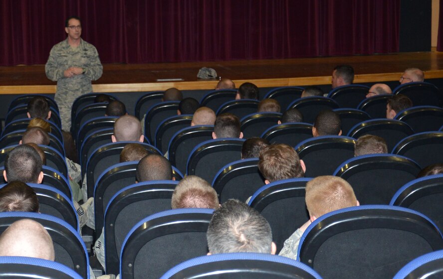 U.S. Air Force Chief Master Sgt. Roger Towberman, 25th AF command chief, speaks with Team Mildenhall members during a town hall meeting April 20, 2015, on RAF Mildenhall, England. Towberman spoke with Airmen about promotions and Enlisted Performance Reports of the future. (U.S. Air Force photo by Gina Randall/Released) 