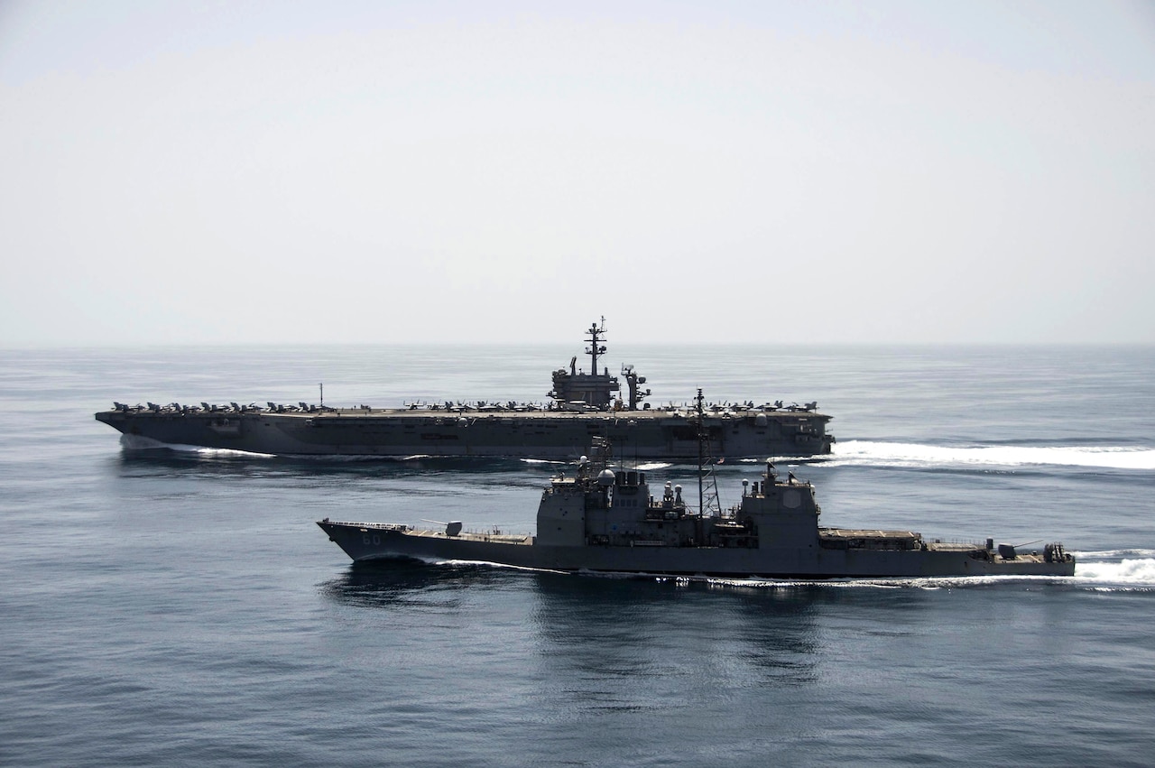 The aircraft carrier USS Theodore Roosevelt and the guided-missile cruiser USS Normandy conduct maritime security operations in the Arabian Sea, April 21, 2015. U.S. Navy photo by Petty Officer 3rd Class Anthony N. Hilkowski