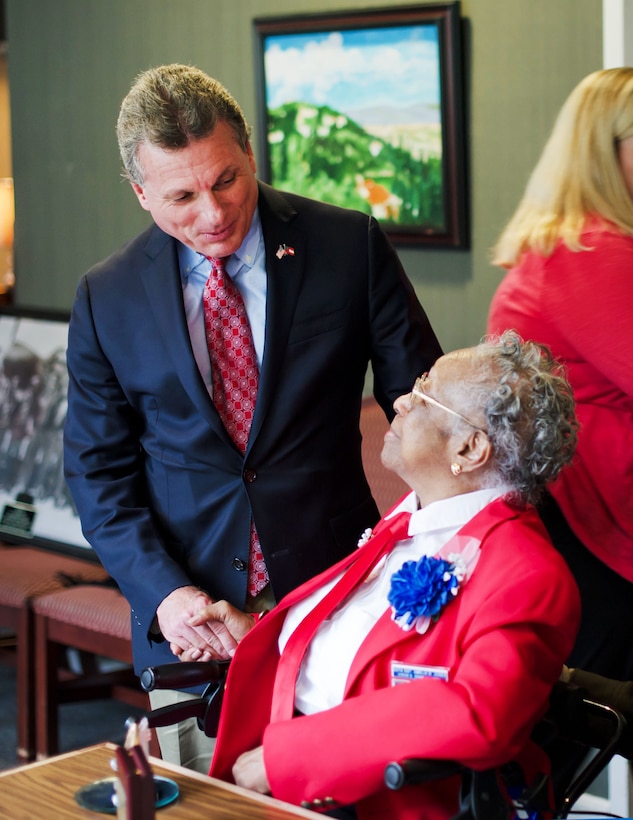 U.S. Rep. Earl “Buddy” Carter of Georgia congratulates Army Air Corps Sgt. Amelia Jones, a veteran of the original Tuskegee Airmen, after she received the Congressional Gold Medal at Hospice Savannah in Savannah, Ga., April 19, 2015. 