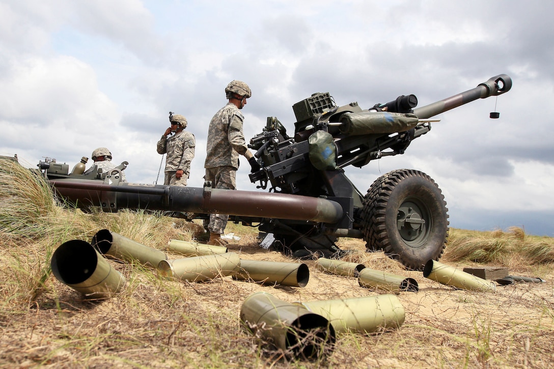 Army paratroopers prepare to fire an M119A3 howitzer on Fort Bragg, N.C ...