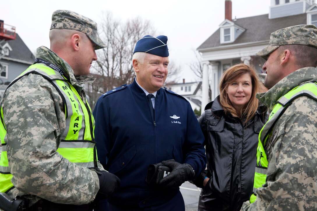 Air Force Maj. Gen. L. Scott Rice, center, adjutant general of the Massachusetts National Guard, talks to Army military policemen before the start of the 2015 Boston Marathon in Hopkinton, Mass., April 20, 2015. About 500 Massachusetts Guardsmen assisted local authorities with security for the event.