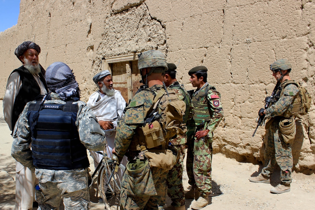 U.S. Marines and Afghan soldiers talk to villagers while conducting a patrol near Bagram Airfield, Afghanistan, April 6, 2015.