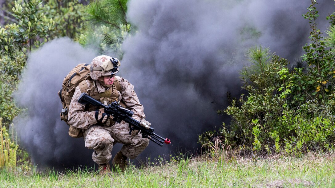 Private First Class John McGraw, a rifleman with 1st Battalion, 6th Marine Regiment, 2nd Marine Division and native of Ashland, Kentucky, collapses during the initial blast of an improvised explosive device during a training exercise aboard Marine Corps Base Camp Lejeune, North Carolina, April 15, 2015. Another Marine steps up and assumes the role and responsibilities that belonged to that Marine that was affected allowing the patrol to continue. (U.S. Marine Corps photo by Lance Cpl. Immanuel Johnson/Released)
