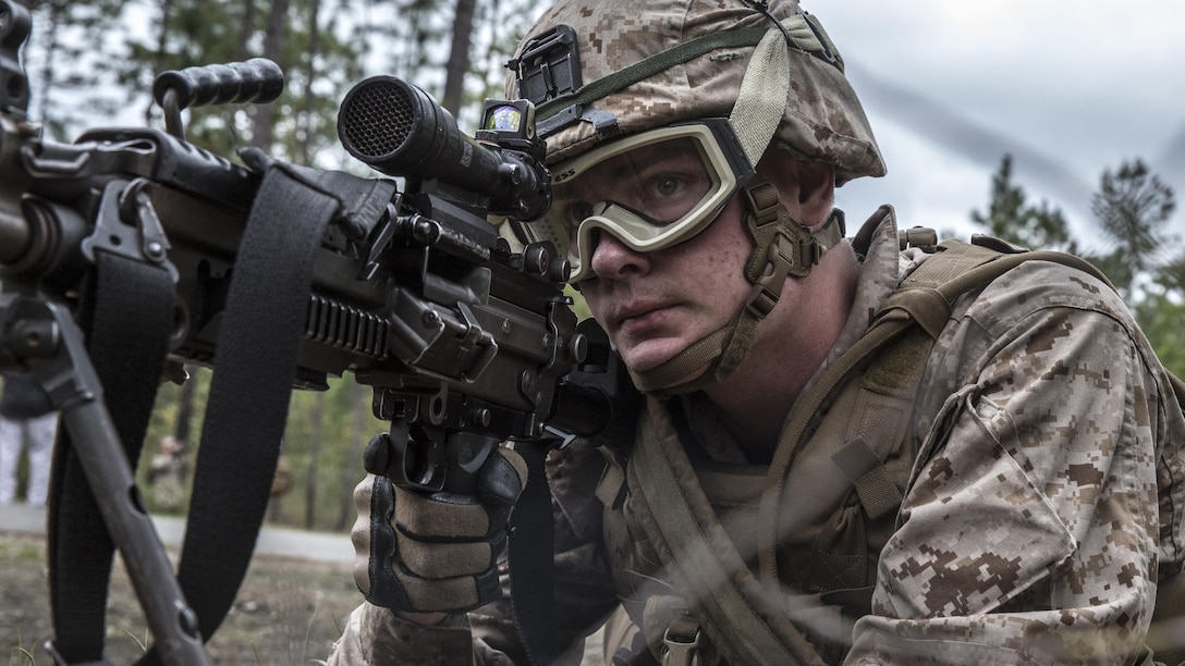 Private First Class Shane Hasenauer, a rifleman with 1st Battalion, 6th Marine Regiment, 2nd Marine Division sights in during a patrol to locate improvised explosive devices aboard Marine Corps Base Camp Lejeune, North Carolina, April 15, 2015. The Marines are expected to keep pushing through the lanes so they can locate the improvised explosive devices that are embedded within the trail. (U.S. Marine Corps photo by Lance Cpl. Immanuel Johnson/Released)