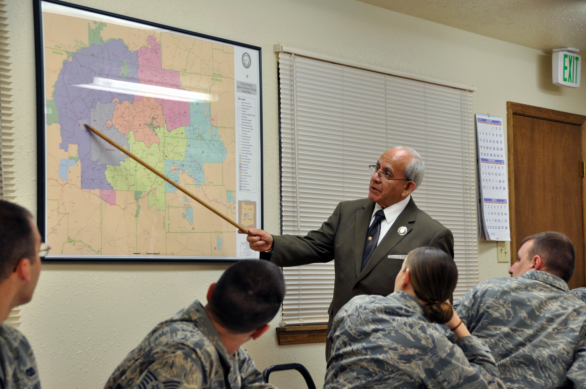 Joseph Esparza, director of the Southwest Indian Foundation’s projects office, explains to members of the 911th Civil Engineer Squadron about where the Navajo Nation resides in the Southwest part of the country in and around the town of Gallup, New Mexico, April 20, 2015. The Navajo Nation has a population of roughly 350,000 individuals, the largest tribe in the nation, encompassing approximately 24,000 square miles or about the size of the state of West Virginia. (Photo by Senior Airman Joseph E. Bridge)