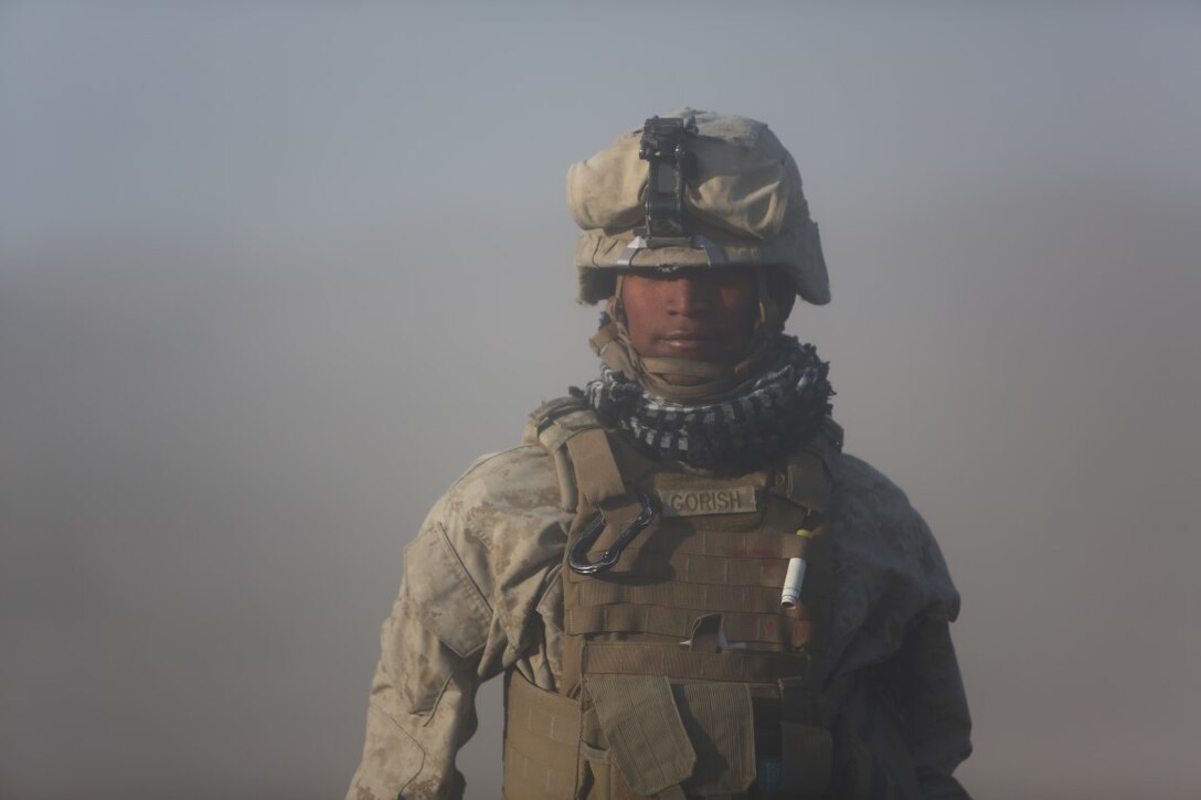 Corporal Osmar S. Gorish, a section chief for Battery A, 1st Battalion, 11th Marine Regiment, 1st Marine Division, returns to his team with the new orders from his executive officer during Exercise Desert Scimitar 2015 aboard Marine Corps Air Ground Combat Center Twentynine Palms, Calif., April 20, 2015. The tough, realistic live-fire training central to Desert Scimitar allows Division units to train in order to maintain readiness and meet current and real-world operational demands.