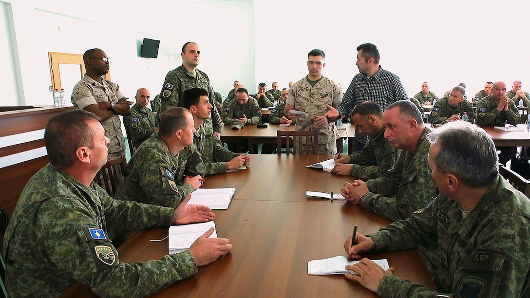 Approximately 65 Kosovo Security Force members and nine U.S. Marines discussed command-and-control, the combat operations center and company-level tactical planning at Camp Adem Jashari in Pristina, Kosovo, April 14-24, 2015. The workshops ended with applying the information gained into a practical application Command Post Exercise scenario. 