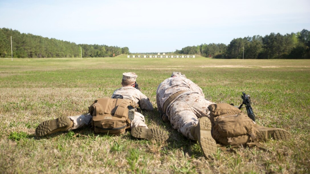 Two Marines with 3rd Battalion, 8th Marine Regiment, sight in on their target during a Designated Marksman Course with the Division Combat Skills Center, April 6-17, 2015 aboard Camp Lejeune, N.C. The course was designed to improve Marines’ knowledge and skill in long range marksmanship.