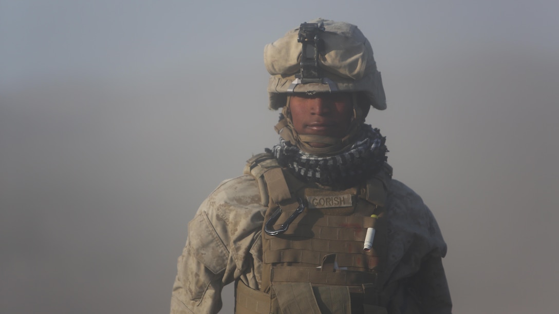 Corporal Osmar S. Gorish, a section chief for Battery A, 1st Battalion, 11th Marine Regiment, 1st Marine Division, returns to his team with the new orders from his executive officer during Exercise Desert Scimitar 2015 aboard Marine Corps Air Ground Combat Center Twentynine Palms, Calif., April 20, 2015. The tough, realistic live-fire training central to Desert Scimitar allows Division units to train in order to maintain readiness and meet current and real-world operational demands.