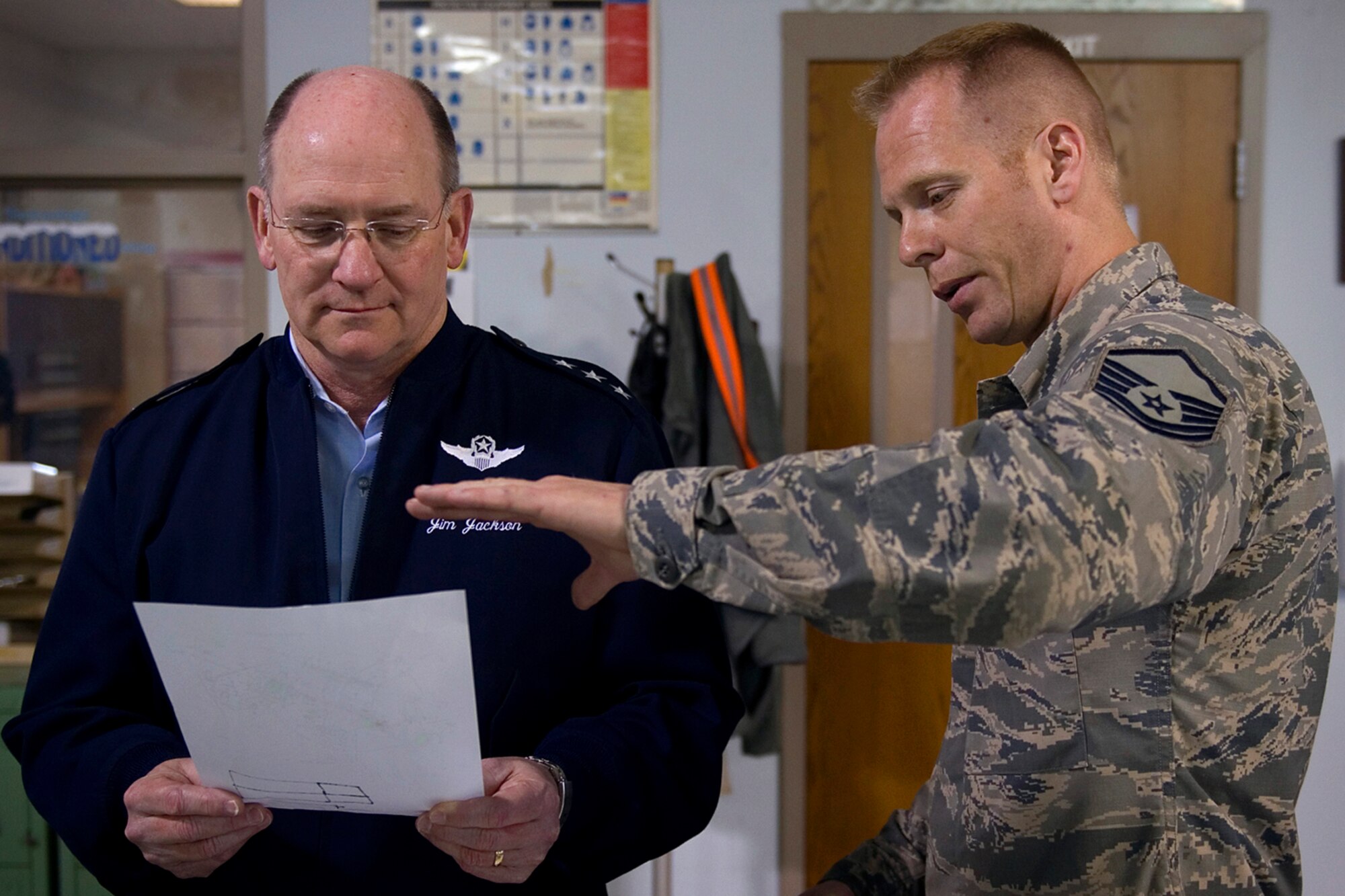 Lt. Gen. James Jackson, Chief of Air Force Reserve and Air Force Reserve Command commander, reviews a set of KC-135R Stratotanker blueprints as Master Sgt. James Massie, 434th Maintenance Squadron metals technology technician, explains how parts are built during a tour at Grissom Air Reserve Base, Ind., April 17, 2015. The 434th MXS uses blueprints to replicate various KC-135R parts that are no longer available due to the age of the aircraft. (U.S. Air Force photo/Tech. Sgt. Benjamin Mota)
