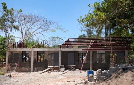 PUERTO PRINCESA, PALAWAN, Philippines (Apr. 21, 2015) - Service members of the U.S. military, Australian Army and Philippine Air Force work together to construct a two classroom Department of the Philippines Standard Building at ENCAP Site 1, Santa Lourdes National High School during exercise Balikatan.  The joint and multinational team consists of service members with the U.S. Army, U.S. Navy, U.S. Marines, Australian Army, and Philippine Air Force. This year marks the 31st iteration of the exercise, which is an annual Philippines-U.S. bilateral military training exercise and humanitarian civic assistance engagement. 