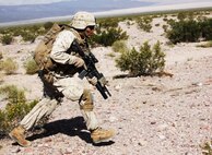 Lance Cpl. Anthony Teyuca, a team leader with Company A, 1st Battalion, 7th Marine Regiment, 1st Marine Division, bounds toward a notional objective during a notional mechanized raid during Exercise Desert Scimitar 15, April 16, 2015. Desert Scimitar is designed to provide tough, realistic live-fire training that allows the 1st Marine Division to improve combat effectiveness and meet current and real-world operational demands.