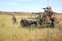Marines with Force Company, 1st Reconnaissance Battalion, 1st Marine Division, maintain security during a training exercise aboard Marine Corps Base Camp Pendleton, Calif., March 16, 2015. The Marines were inserted into the training area by a CH-53E Super Stallion and immediately assumed their positions in the formation.