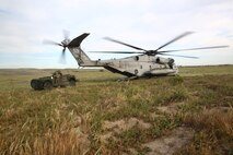 A CH-53E Super Stallion inserts a team of reconnaissance Marines with Force Company, 1st Reconnaissance Battalion, 1st Marine Division, during a training exercise aboard Marine Corps Base Camp Pendleton, Calif., March 16, 2015. The Marines were honing their insertion capabilities with an Internally Transportable Vehicle.
