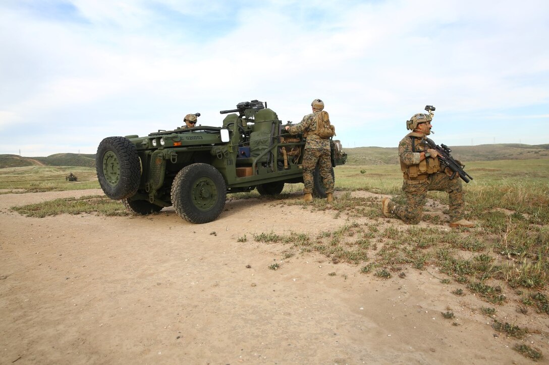 Marines with Force Company, 1st Reconnaissance Battalion, 1st Marine Division, set security and assemble the canopy and mounted weapon of the Internally Transportable Vehicle during a training exercise aboard Marine Corps Base Camp Pendleton, Calif., March 16, 2015. Reconnaissance Marines can be inserted not only with ITVs, but by parachute jumping or even on foot.
