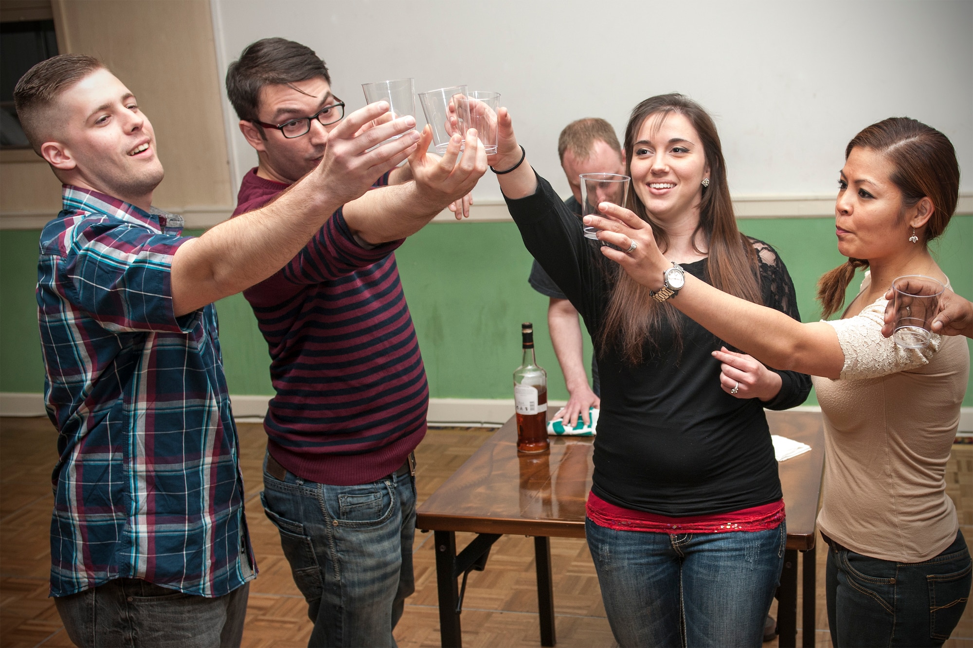 Members of the Kunsan Sexual Assault Theater Group act out a skit during Drinks and Dialogue April 18, 2015, at Kunsan Air Base, Republic of Korea. SATG performances were held in conjunction with Drinks and Dialogue, a quarterly event that provides Airmen an opportunity to give feedback in a retribution-free environment, covering a wide range of topics including sexual assault, domestic abuse, relationships and culture. (U.S. Air Force photo by Senior Airman Katrina Heikkinen/Released)