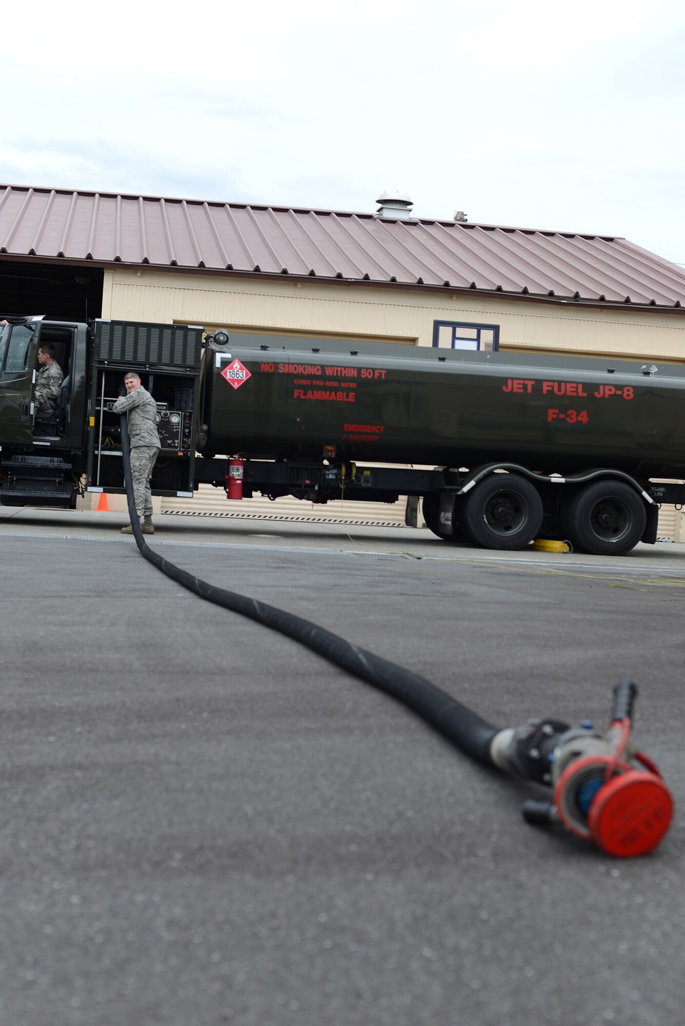 Members of the 374th Logistics Readiness Squadron perform a preventative maintenance inspection for an R-11 fuel truck at Yokota Air Base, Japan, April 21, 2015. The R-11 is the primary mobile refueling vehicle used by the U.S. Air Force. (U.S. Air Force photo by Airman 1st Class David C. Danford/Released) 