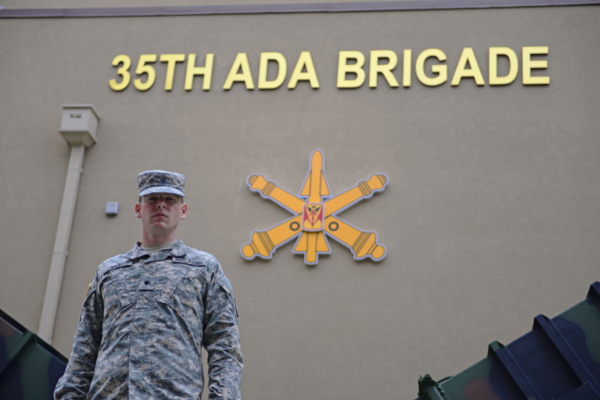 Army Spc. Alexander Knoll, Charlie Battery 6-52 Air Defense Artillery Battalion tactical control assistant for the Patriot Missile System, poses for a photo April 16, 2015, at Osan Air Base, Republic of Korea. Knoll was chosen as a Team Osan Spotlight award winner. Individuals who are chosen for this spotlight recognition are distinguished as consistent, superior performers within their squadrons. (U.S. Air Force photo by Staff Sgt. Benjamin Sutton/Released) 
