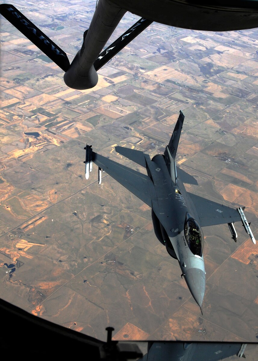 A 114th Fighter Wing F-16 Fighting Falcon rendezvoused with a KC-135R Stratotanker from the 185th Air Refueling Wing, Sioux City, IA, during an air refueling training mission that took off from Joe Foss Field, S.D., April 11, 2015. The 114th Fighter Wing and South Dakota Employer Support of the Guard and Reserve (ESGR) hosted a Boss Lift to provide employers an opportunity to see first-hand what citizen-Airmen experience while away from work to attend military training or activated for a federal or state mission.(National Guard photo by Staff Sgt. Luke Olson/Released)