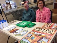 Frank Carpenter, left, 341st Civil Engineer Squadron environmental protection specialist, and his wife Deborah Carpenter, 341st CES training manager, offer free reusable items April 22, 2015 at Malmstrom Air Force Base, Mont. The Carpenters had a booth open to spread awareness about protecting the environment for Earth Day. (U.S. Air Force photo/ Tech. Sgt. Chad Thompson)