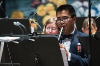 Airman 1st Class Randolph Palada, U.S. Air Force Band of the West clarinet player, performs Fiesta classics during the annual Fiesta in Blue concert April 21 at Trinity University’s Laurie Auditorium in San Antonio, Texas. The Air Force’s Band of the West is headquartered at Joint Base San Antonio-Lackland and the band has been a part of Fiesta San Antonio events for more than 20 years.  The objective of the Air Force Bands program is to inspire patriotism and encourage young men and women to serve in the Air Force and other branches of the military.  The Air Force Bands Program is a family of 10 active-duty Air Force bands and five Air National Guard bands. Each band operates within its own geographic area of responsibility representing America's Airmen to a global audience. (U.S. Air Force photo by Airman 1st Class Stormy Archer/released)