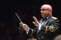 Chief Warrant Officer 4 Thomas W. Hager, United States Army guest conductor, directs U.S. Air Force Band of the West members during the annual Fiesta in Blue concert April 21 at Trinity University’s Laurie Auditorium in San Antonio, Texas. The Air Force’s Band of the West is headquartered at Joint Base San Antonio-Lackland and the band has been a part of Fiesta San Antonio events for more than 20 years.  The objective of the Air Force Bands program is to inspire patriotism and encourage young men and women to serve in the Air Force and other branches of the military.  The Air Force Bands Program is a family of 10 active-duty Air Force bands and five Air National Guard bands. Each band operates within its own geographic area of responsibility representing America's Airmen to a global audience. (U.S. Air Force photo by Airman 1st Class Stormy Archer/released)