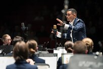 Capt. Rafael Toro-Quinones, U.S. Air Force Band of the West commander, directs band members playing Fiesta classics during the annual Fiesta in Blue concert April 21 at Trinity University’s Laurie Auditorium in San Antonio, Texas. The Air Force’s Band of the West is headquartered at Joint Base San Antonio-Lackland and the band has been a part of Fiesta San Antonio events for more than 20 years.  The objective of the Air Force Bands program is to inspire patriotism and encourage young men and women to serve in the Air Force and other branches of the military.  The Air Force Bands Program is a family of 10 active-duty Air Force bands and five Air National Guard bands. Each band operates within its own geographic area of responsibility representing America's Airmen to a global audience. (U.S. Air Force photo by Airman 1st Class Stormy Archer/released)